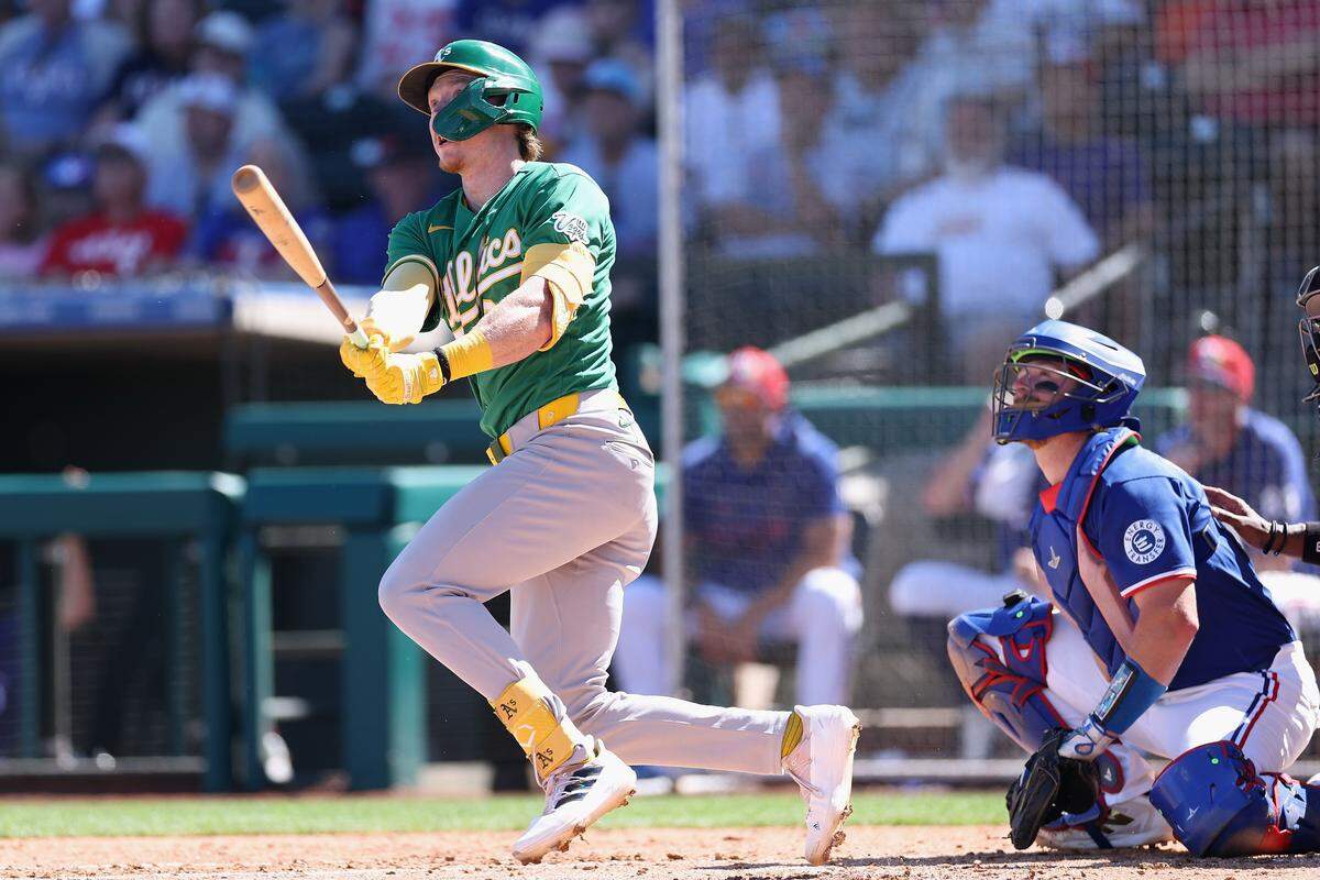SURPRISE, ARIZONA - MARCH 12: Henry Bolte #33 of the Athletics hits a solo home run against the Texas Rangers during the third inning of the spring training game at Surprise Stadium on March 12, 2026 in Surprise, Arizona. (Photo by Christian Petersen/Getty Images)