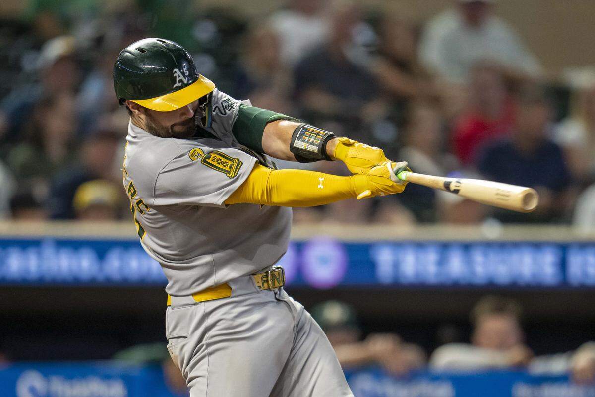 Aug 20, 2025; Minneapolis, Minnesota, USA; Athletics catcher Shea Langeliers (23) hits a two run home run in the tenth inning against the Minnesota Twins at Target Field. Mandatory Credit: Jesse Johnson-Imagn Images