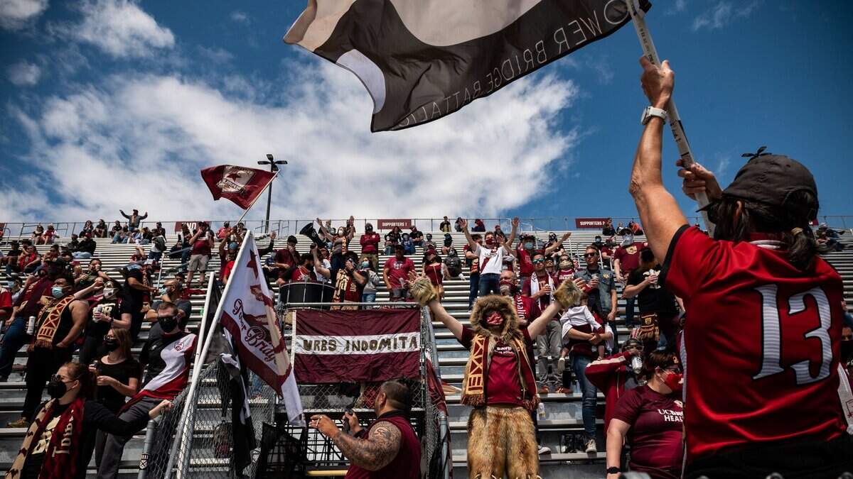 Sacramento Republic FC super-fan Rave Bear rstands to cheer among the Tower Bridge Battalion as they chant and drum during the second half of their friendly USL soccer match against the Real Monarchs of Salt Lake City on Saturday, April 24, 2021, at Papa Murphys Park in Sacramento County.