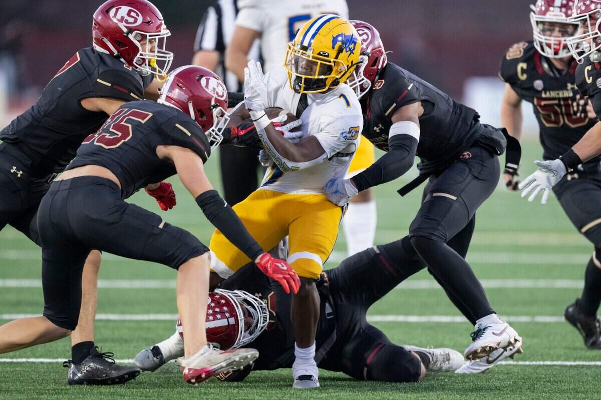 Grant Pacers running back Wayshawn Parker (1) rushes up the middle in the first half of the CIF Division 2-AA state football championship against the La Serna Lancers on Friday, Dec. 8, 2023, at Saddleback College in Mission Viejo.