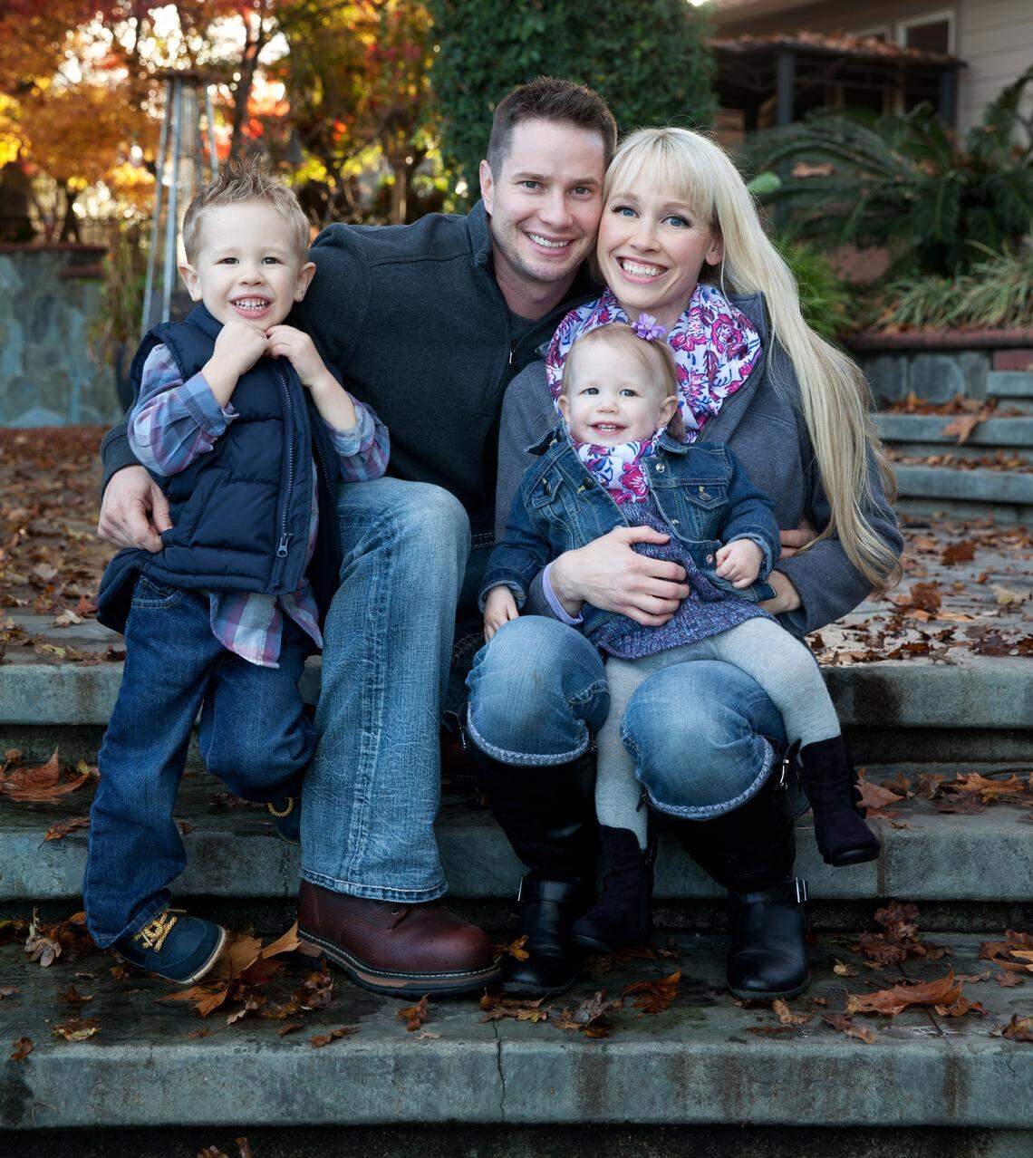 Keith and Sherri Papini pose with their children in a family photograph from before her disappearance.