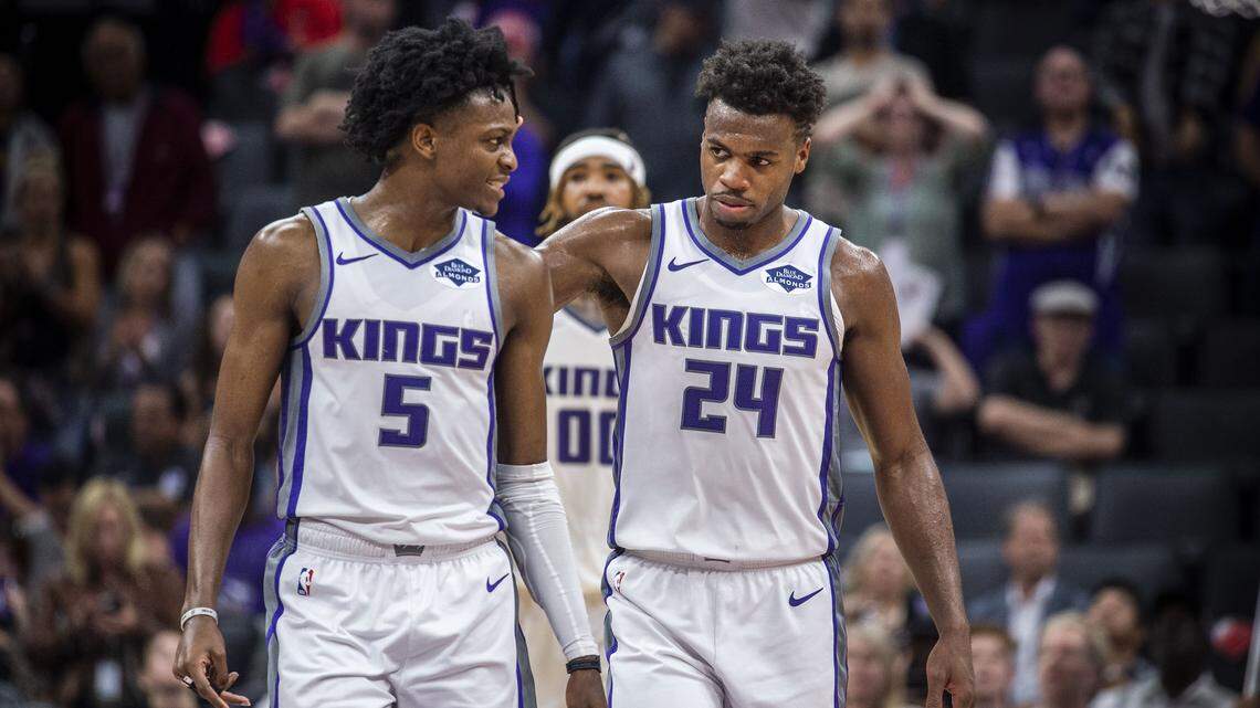 Sacramento Kings guard De’Aaron Fox (5) is comforted by teammate Sacramento Kings guard Buddy Hield (24) after missing one free throw in the final seconds of the game against the Washington Wizards on Friday, Oct. 26, 2018 at the Golden 1 Center in Sacramento, Calif.