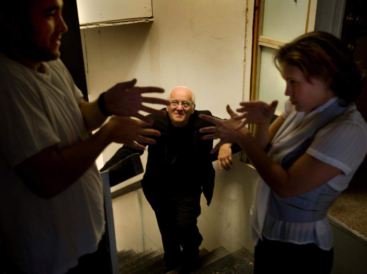 Actor, director and producer Ed Claudio works with actors Brian Rife, left, and Tygar Hicks on the stairway in his 25th Street studio on Aug. 27, 2009.
