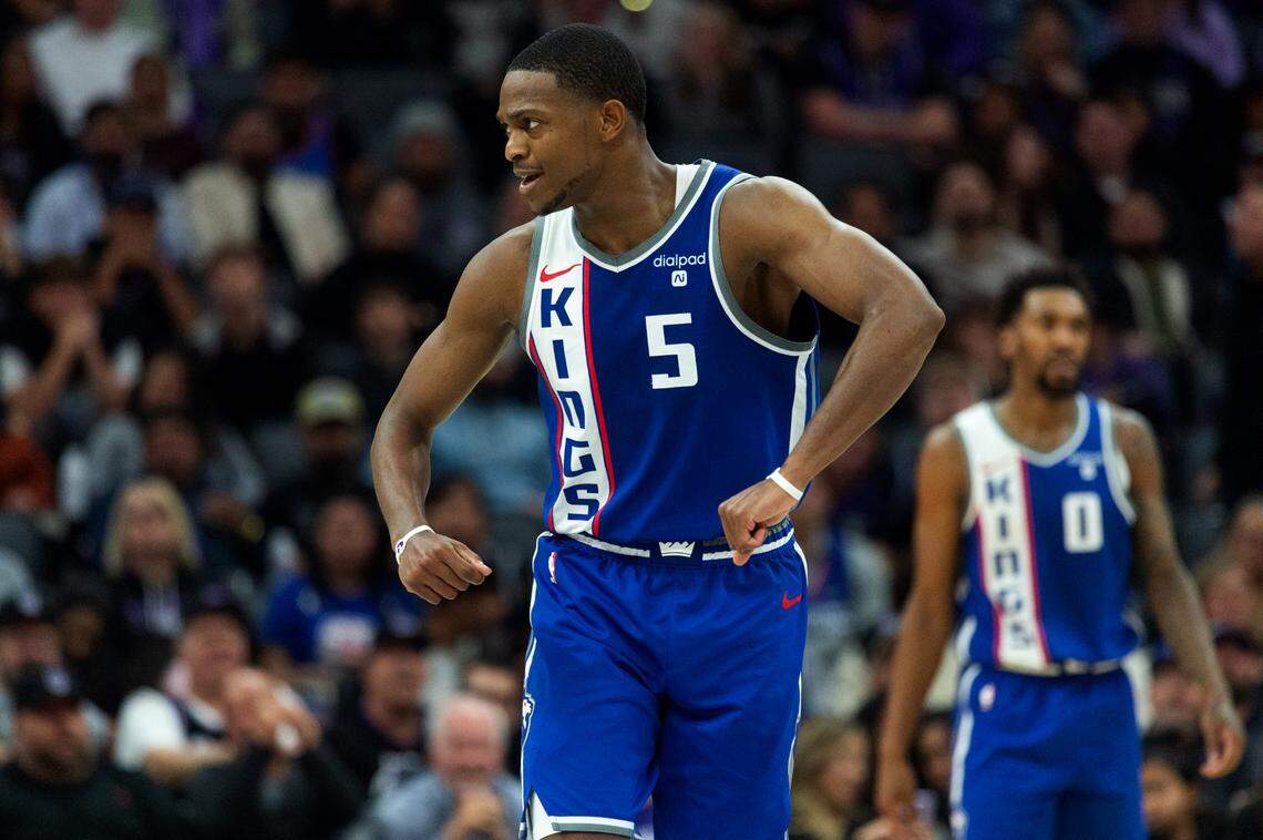 Sacramento Kings guard De’Aaron Fox (5) reacts after pressuring LA Clippers guard James Harden (1) during an NBA game at Golden 1 Center on Wednesday, Nov. 29, 2023 in Sacramento.