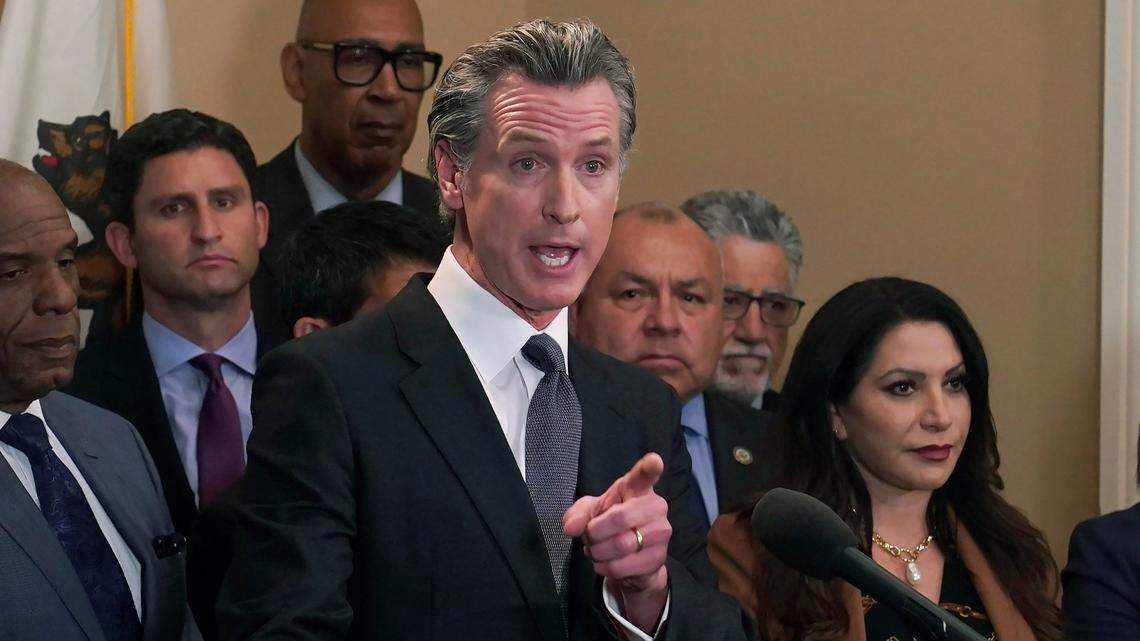 California Gov. Gavin Newsom discusses the recent mass shooting in Texas, during a news conference in Sacramento on Wednesday. Flanked by lawmakers from both houses of the state legislature, Newsom said he is ready to sign more restrictive gun measures passed by lawmakers.