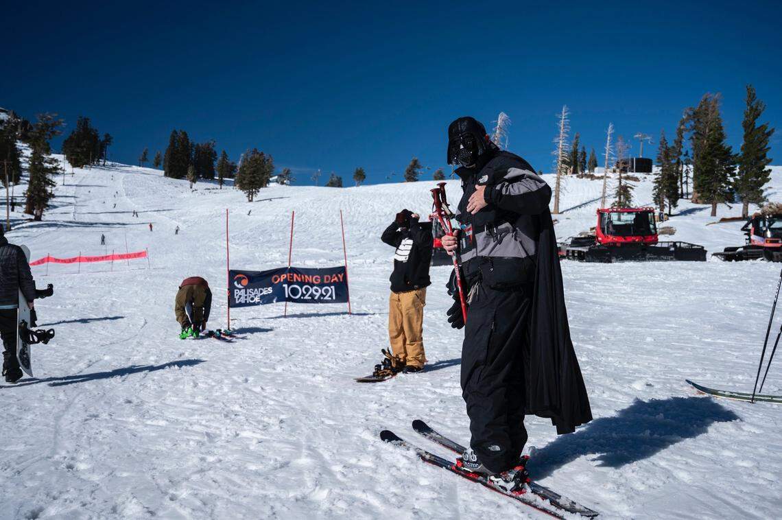 Dressed as Darth Vader for a Halloween weekend ski day, Dave Redwine of Rocklin waits for his family at the start of a run at Palisades Tahoe on Oct. 29, the first day of the season. It was only the third time in 72 years the resort has been able to open in the month of October. Early openings could be even more rare in the future.