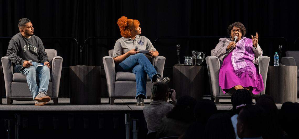 Sacramento State Graduate student Terance Dass (left) and 4th year Sociology major Jasmine Owens (middle) listen to California Secretary of State Shirley Weber (right) discuss reparations in the University Union Ballroom at Sacramento State on Tuesday, Feb. 7, 2023.