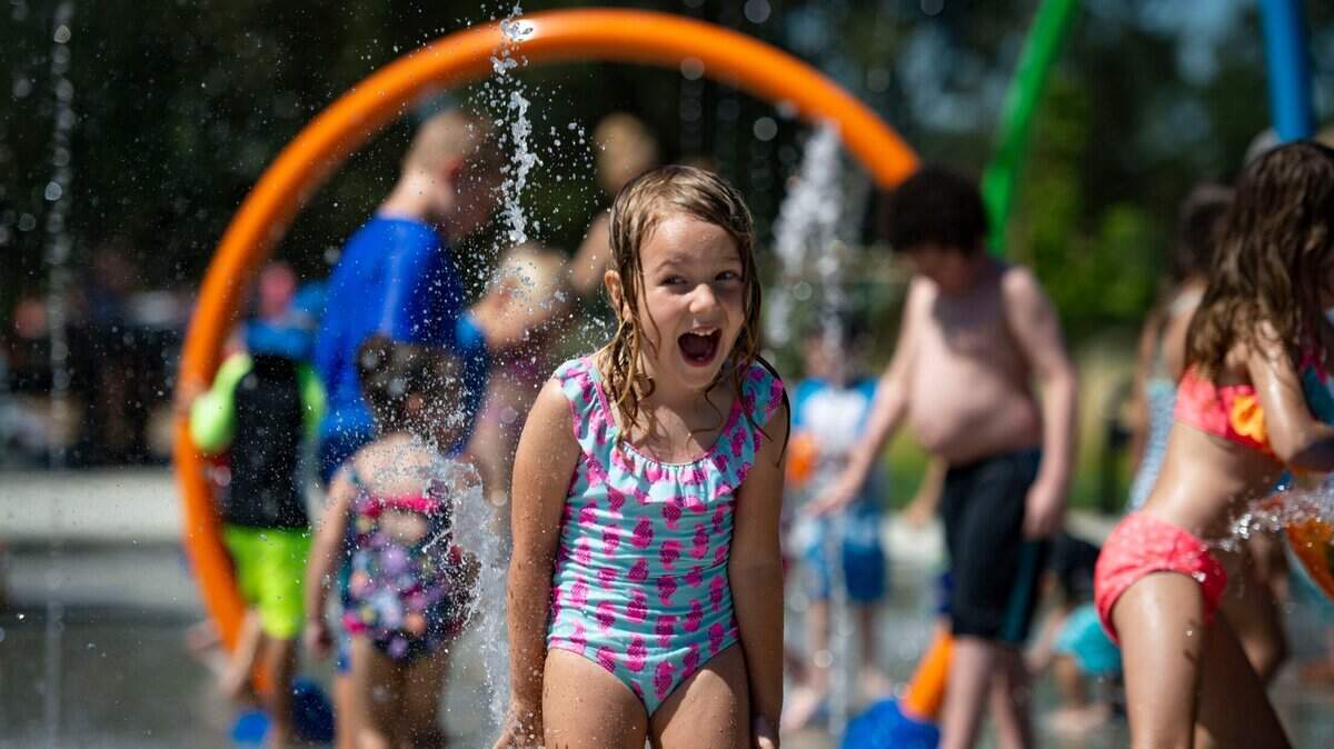 Lucy West, 5, plays in the water at the opening day of the splash pad at Johnson-Springview Park in Rocklin in 2020.