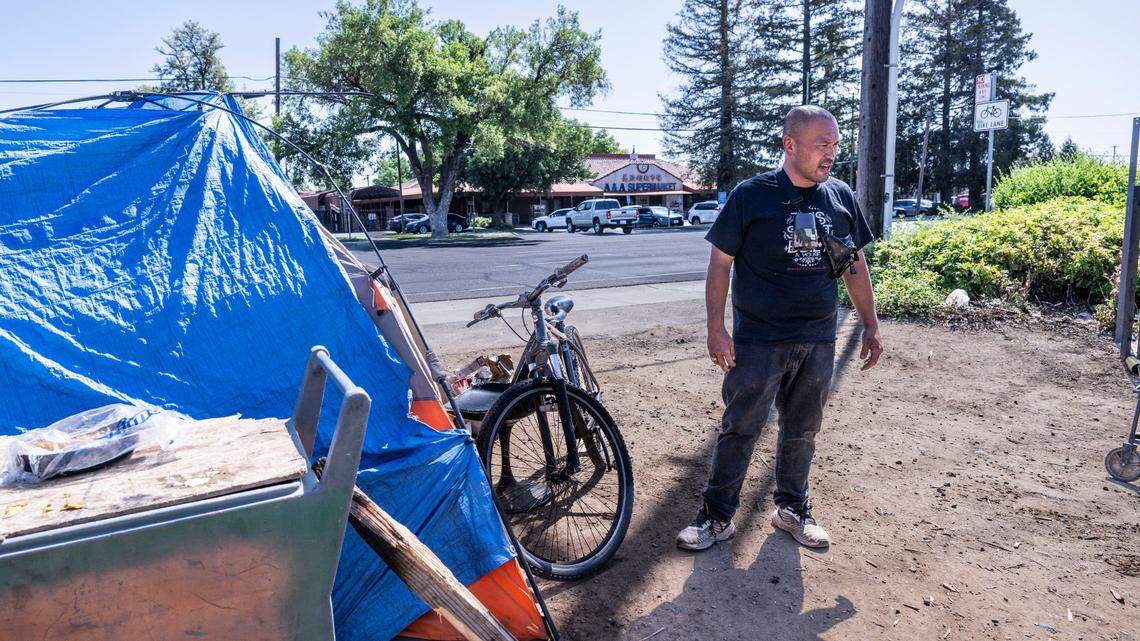 Andy, a homeless man living on Stockton Boulevard, keeps an eye on his dog on Monday, April 21, 2025, after a nearby press conference in support of homeless reform. A proposal by President Donald Trump to end a long-time federal affordable housing program could increase homelessness in California and throughout the nation.