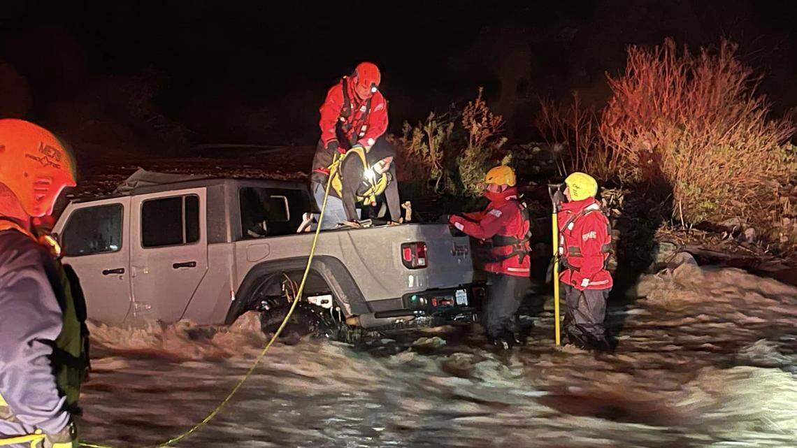Raging floodwaters trapped a family of three inside their Jeep after they tried to cross a swollen creek in California on Sunday. 