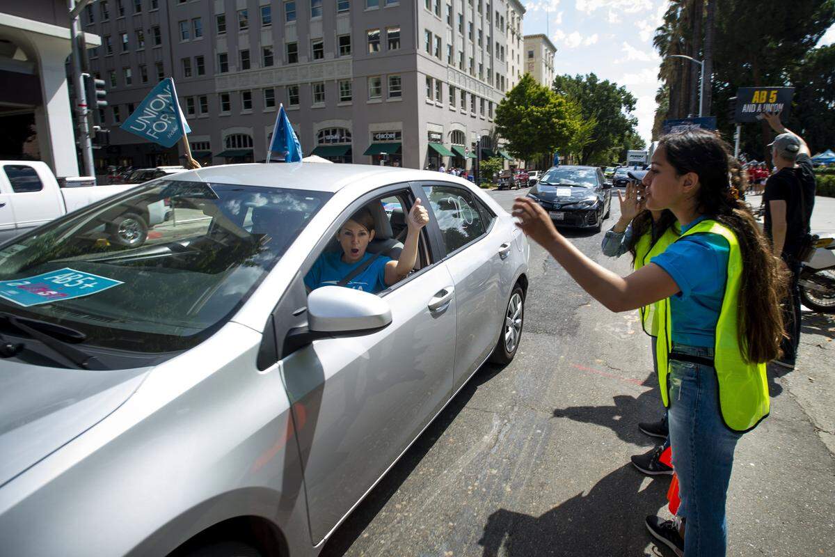 A ride share driver circles the capitol building as hundreds of Uber and Lyft drivers converged on the California state Capitol on Wednesday, Aug. 28, 2019 to support AB 5. The bill would force “gig economy” employers to treat independent contractors as employees.