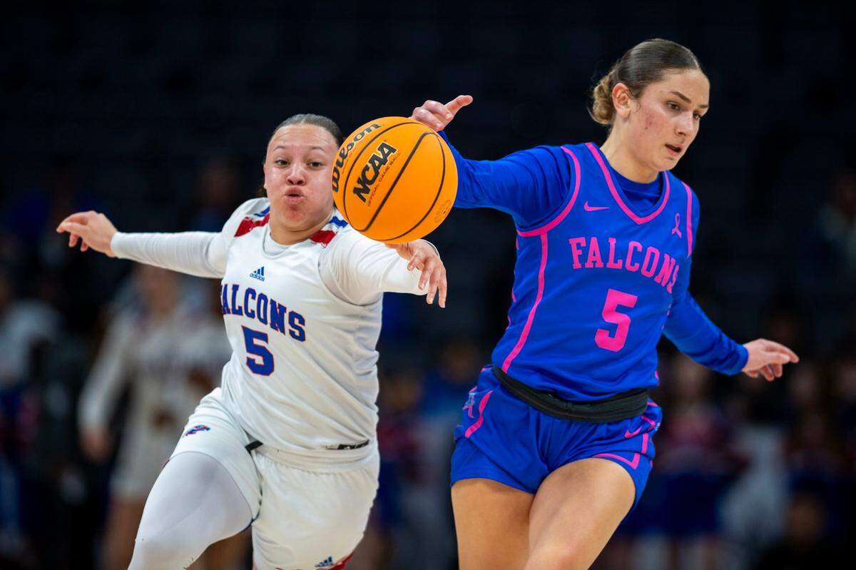 The Christian Brothers Falcons’ Aleyah Harmon (5) and the Atwater Falcons’ Jolie Hart (5) chase after a loose ball in the first half of the CIF Sac-Joaquin Section Division ll girls basketball championship game at Golden 1 Center on Thursday, Feb. 27, 2025.
