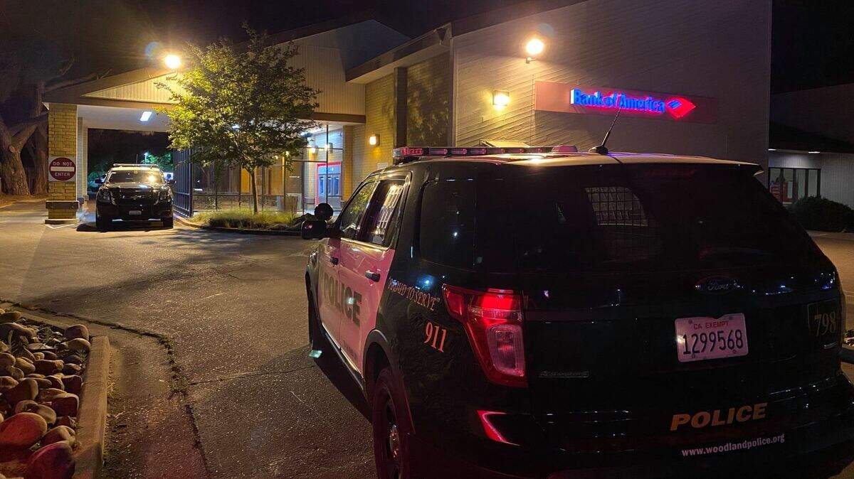 Authorities say a 39-year-old Woodland man was caught with burglary tools and a gas mask across the street from the Bank of America Branch on West Main Street, where security reported a burglary in progress.