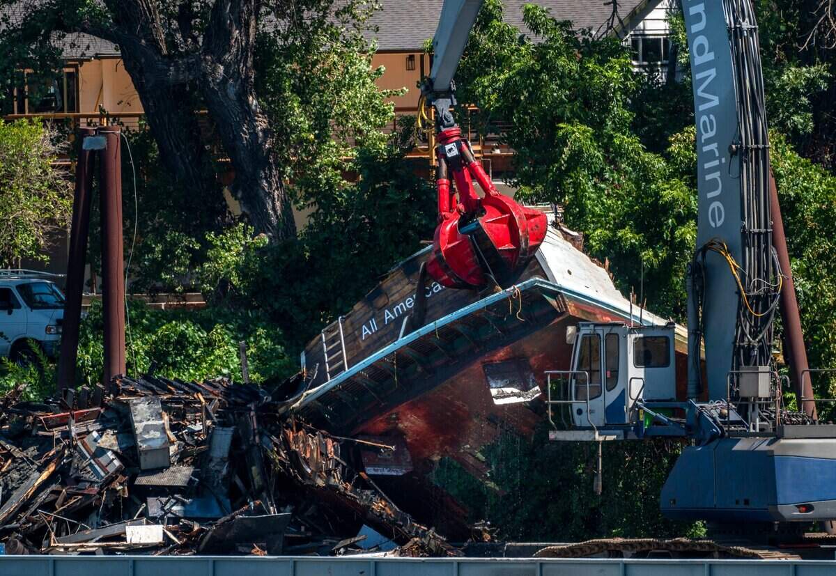 The “All American,” a derelict 85-foot, privately owned vessel that caught fire in June on the Sacramento River, is removed from the water Wednesday, August 3, 2022. The boat was deconstructed on the water, piled onto a barge, and transported to the Lind Marine Shipyard in Vallejo for disposal.