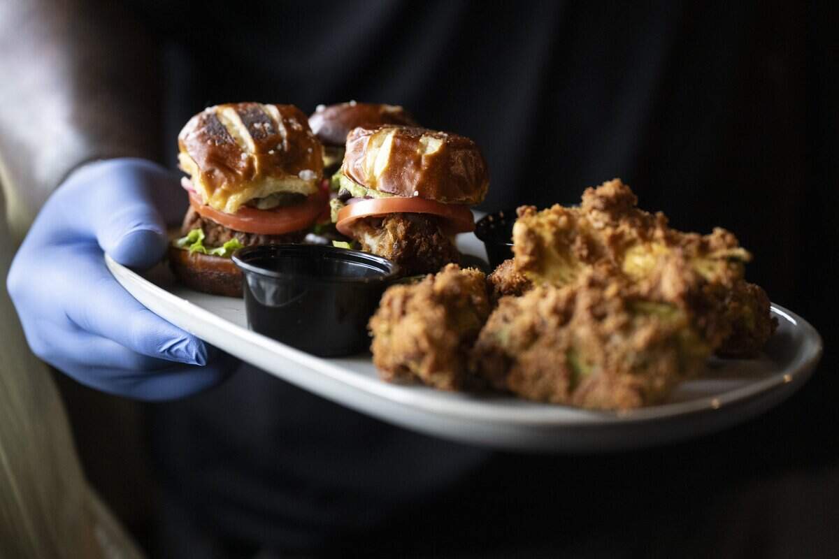 Elevated Eats’ oyster mushroom slider sampler and avocado fries at TAP Wine Lounge in Sacramento on Thursday, Dec. 4, 2025.