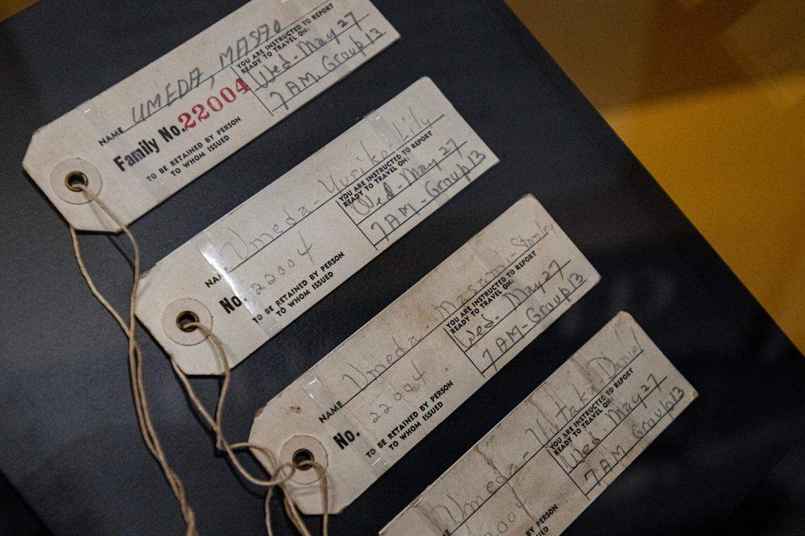 The numbered tags of Sam Umenda’s family are displayed at the new “Uprooted: An American Story” exhibition at the California Museum in Sacramento. The family’s number was 22004, and they had to wear it on their clothes and attach it to their luggage when they left their homes for the incarnation camps during World War II.