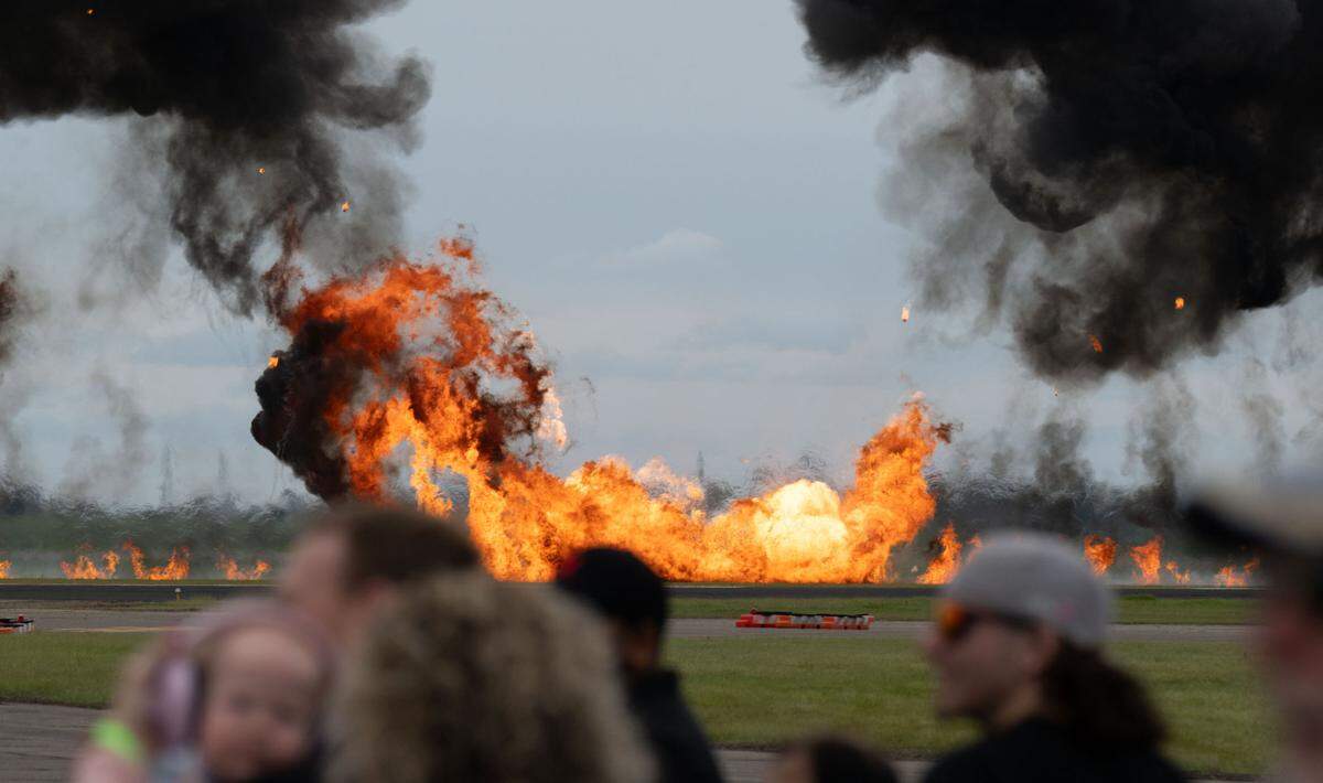 Pyrotechnics are detonated as aircraft fly overhead at the California Capital Airshow at Mather Airport on Saturday, March 22, 2025.