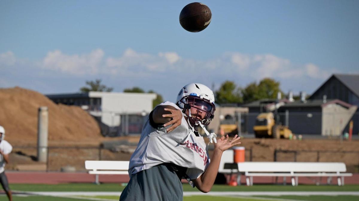 Hiram Johnson High School varsity football quarterback Marino Fragata practices his team on Sept. 20.