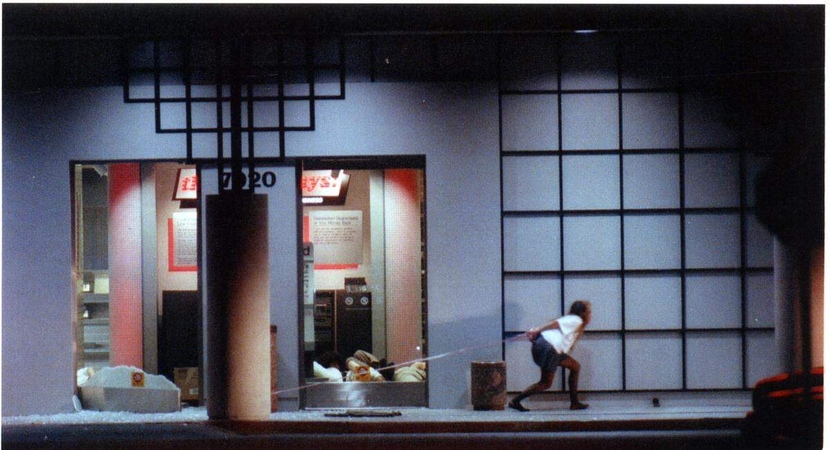 A hostage, still tied to the store’s entrance, tried to flee when firing erupted after a sheriff’s sniper took a shot at one of the gunman at Good Guys electronics store on April 4, 1991, that left six dead, including three hostages.
