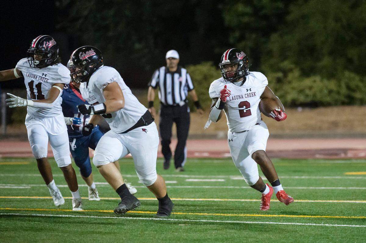 Laguna Creek Cardinals running back Armon Thorntona (2) runs the ball for a first down in the second half of the game against the Pleasant Grove Eagles in September at Sheldon High School.