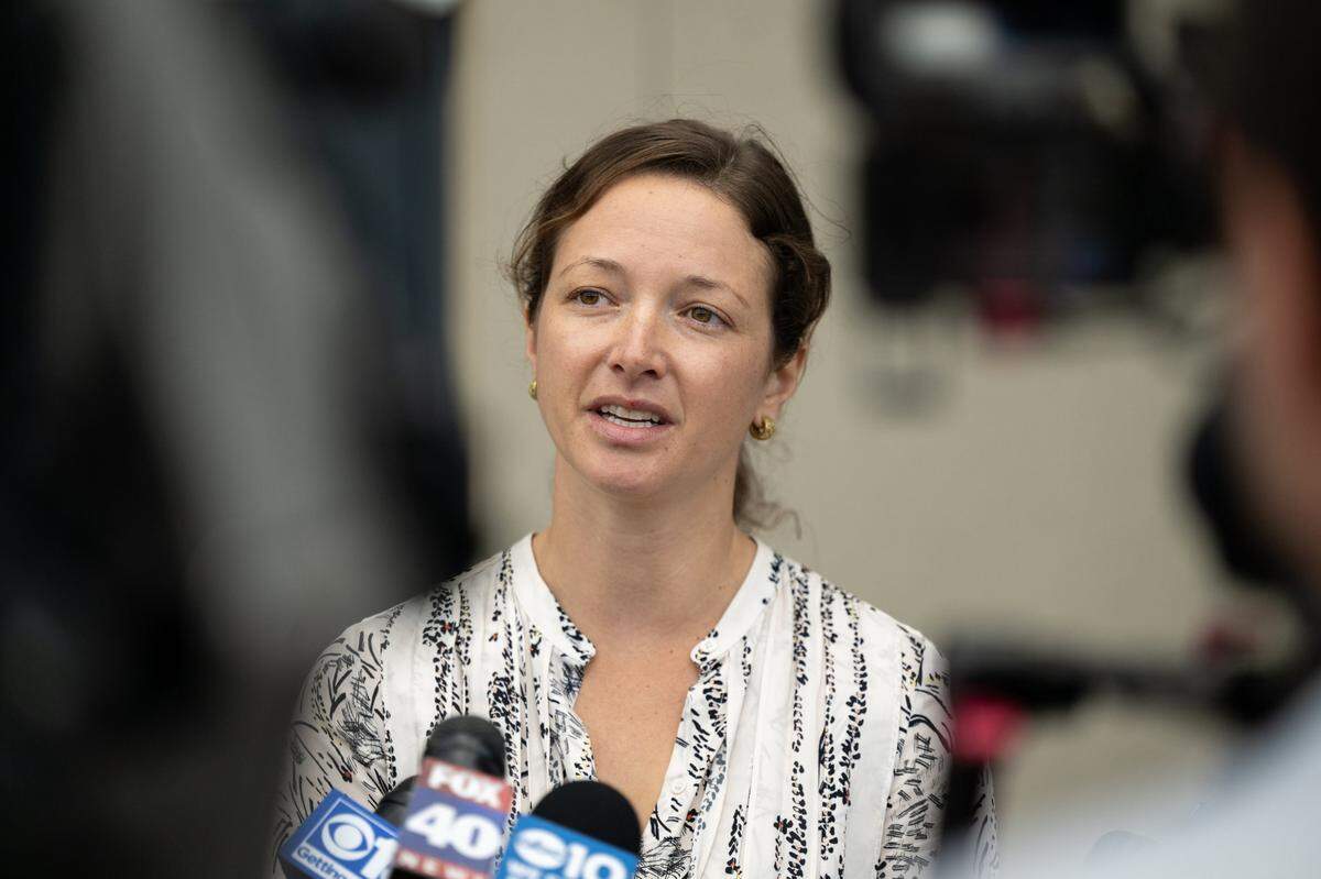 Adrienne Spohr, daughter of Robert Gary Spohr and Wendy Wood, speaks to the media after the arraignment of Samantha Maria Scott in the Placer Superior Court in Roseville on Monday. Wood was charged with murder and attempted murder in the case of the fatal shooting of her father and the attempted homicide of her mother at their Lake Tahoe home. Former Major League Baseball player Daniel Serafini, the couple’s son-in-law, was charged in the case last week.