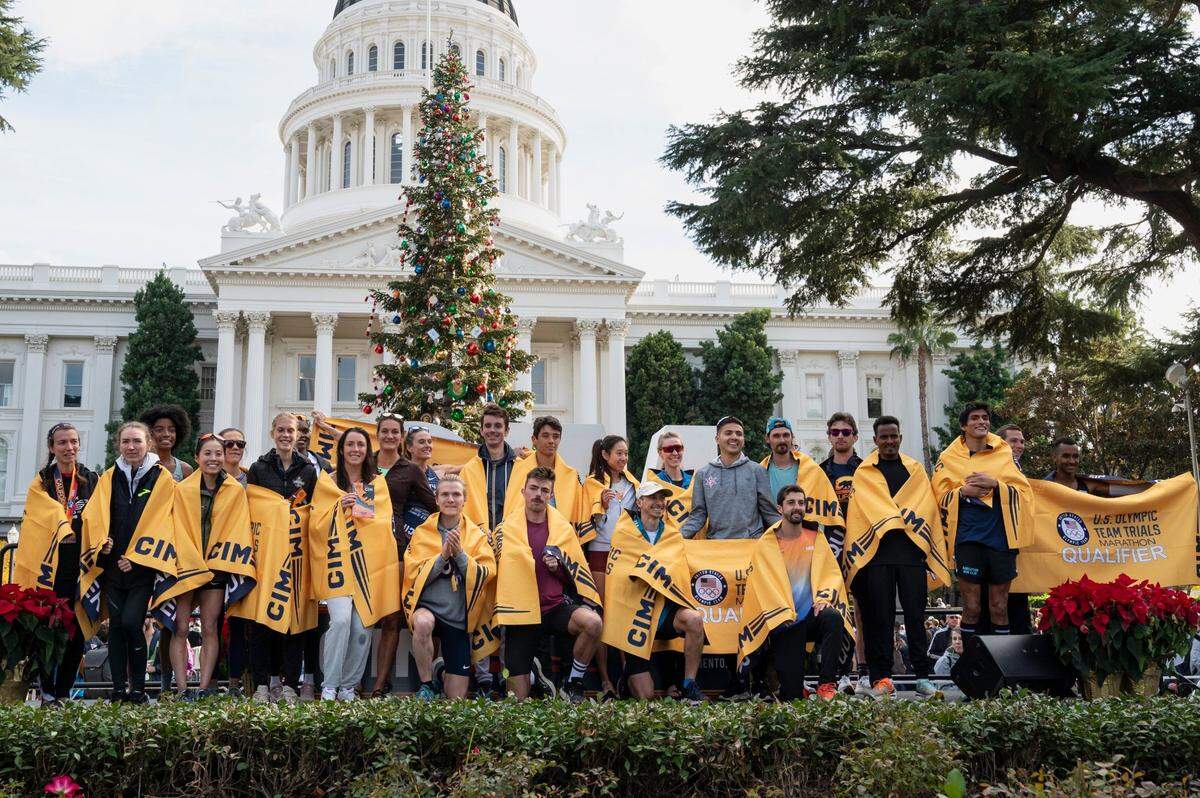 Runners who finished with Olympic trials qualifying times are recognized during the 40th California International Marathon from Folsom to the state Capitol in downtown Sacramento on Sunday, Dec. 3, 2023.