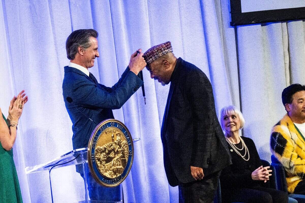 Choreographer Alonzo King receives his medal from Gov. Gavin Newsom during the California Hall of Fame induction ceremony on Tuesday, Dec. 13, 2022 in Sacramento.