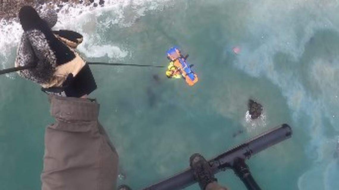 A helicopter airlifted an 18-year-old woman to safety after her car plunged off the Pacific Coast Highway into the ocean, California video shows.