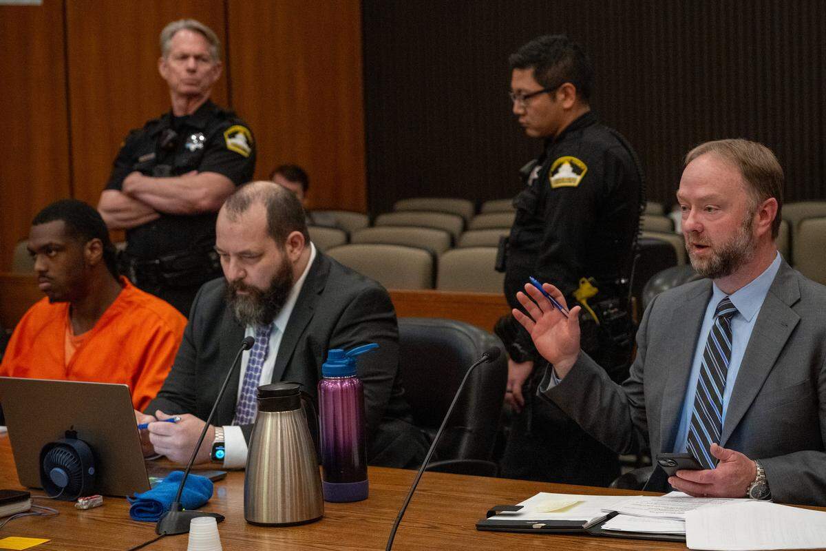 Prosecutor Kevin Jones, right, speaks with the judge during the sentencing of DeSean Leon Brasser Jr., left, alongside defense attorney Alex Asterlin, for the October 2022 murder of Charles Starzynski at the Gordon D. Schaber Sacramento County Courthouse on Friday, April 10, 2026. Brasser was sentenced to life in prison without the possibility of parole.
