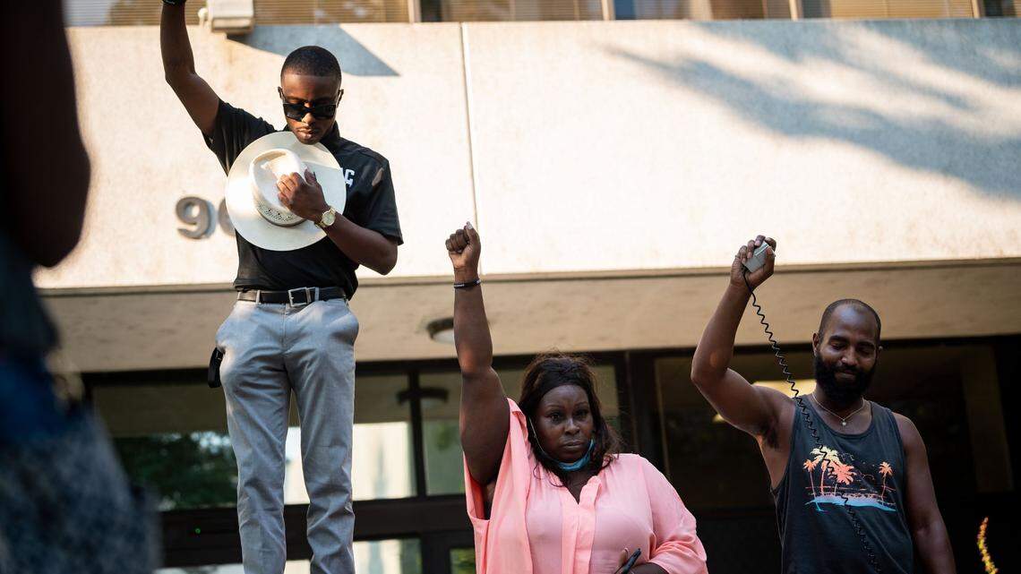 Se’Quette Clark, center, mother of Stephon Clark, who was killed by Sacramento police in 2018, stands next to her other son and activist Stevante Clark during a moment of silence in solidarity with the family of Jacob Blake during the Justice for Jake event outside the Sacramento County District Attorney’s Office on Wednesday, Aug. 26, 2020, in downtown Sacramento. The Clark family did not receive justice after Stephon Clark's death, but the guilty verdict in the Derek Chauvin trial sent a message of hope to Black families nationwide.