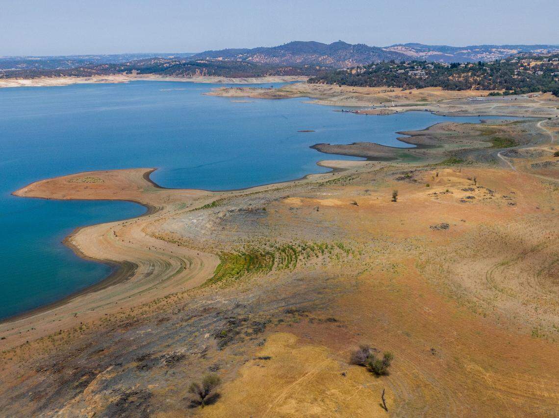 Low water levels leave much of the lakebed exposed at Folsom Lake on July 25, when the reservoir’s surface elevation was 377 feet. The lake holds about a third of its normal amount of water for this time of year.