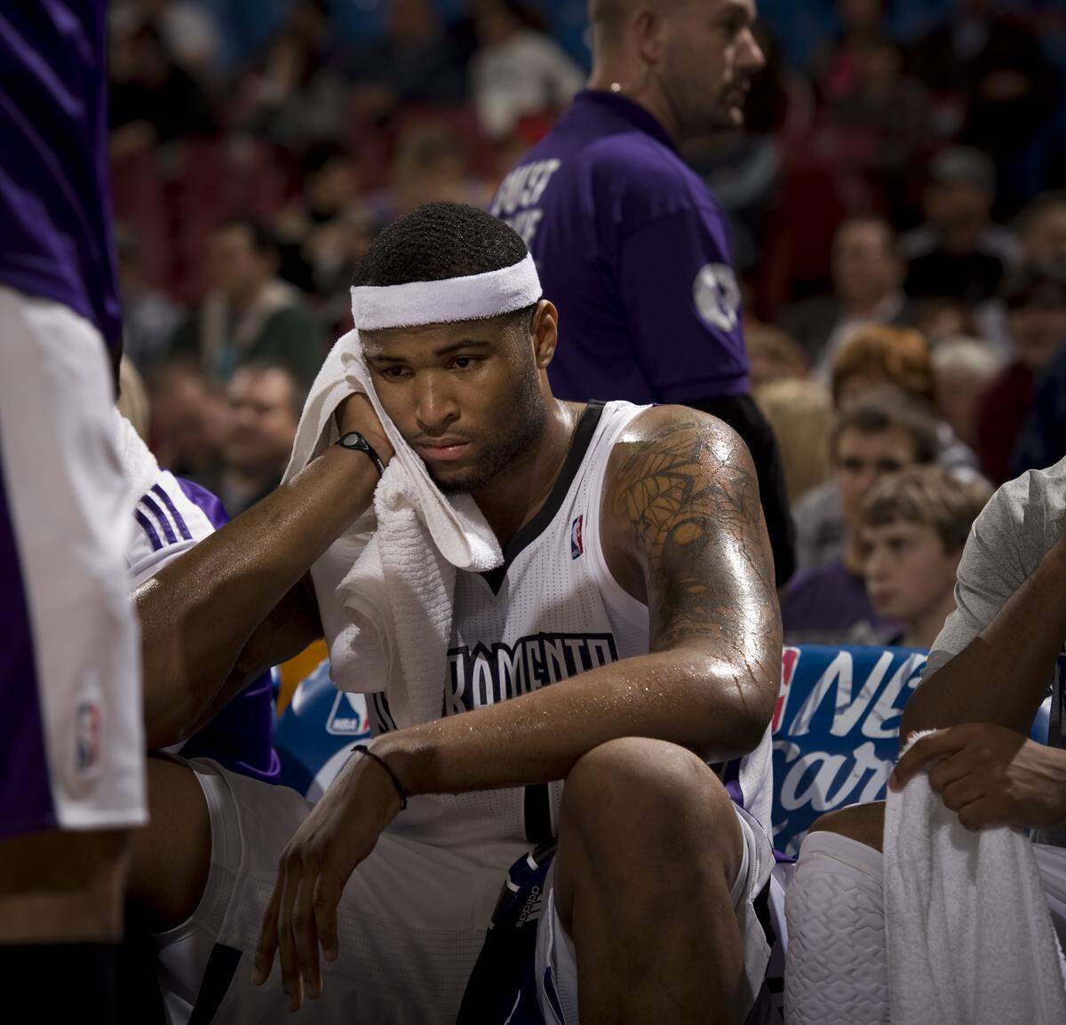 DeMarcus Cousins sits on the team bench in the final minute of Sacramento's 102-80 loss to the Philadelphia 76ers at Power Balance Pavilion in Sacramento on March 18, 2011.