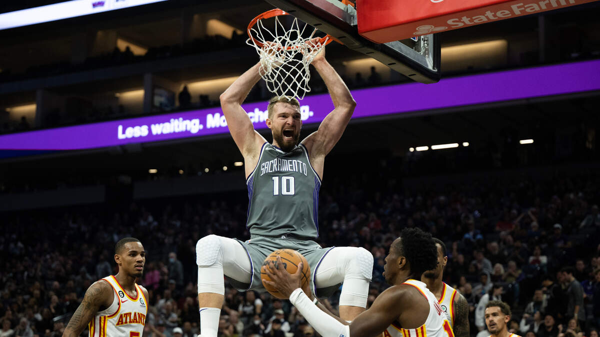 Sacramento Kings forward Domantas Sabonis (10) reacts after dunking the ball over Atlanta Hawks forward Onyeka Okongwu (17) during a game at Golden 1 Center in Sacramento, Wednesday, Jan. 4, 2023.