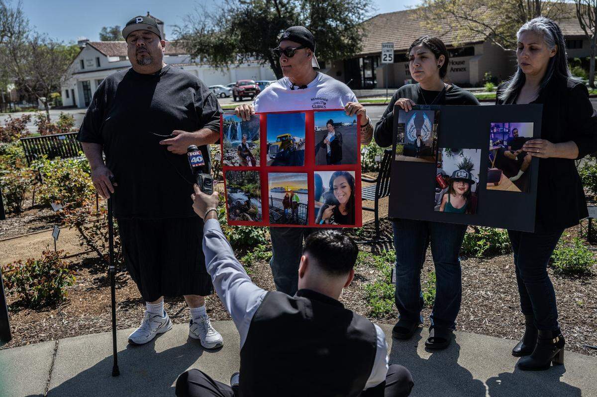 Family members of crash victims Tina Vital, 43, and Adalina Lilah Perez, 4, hold up their photos during a press conference on Wednesday, April 12, 2023, in Woodland, after the first court appearance of the 13-year-old boy who stole an SUV and crashed during a police chase – killing two and injuring 11 others. From left are Victor Ramirez, Armando Preciado, Vanessa Ramos and Elizabeth Copete.