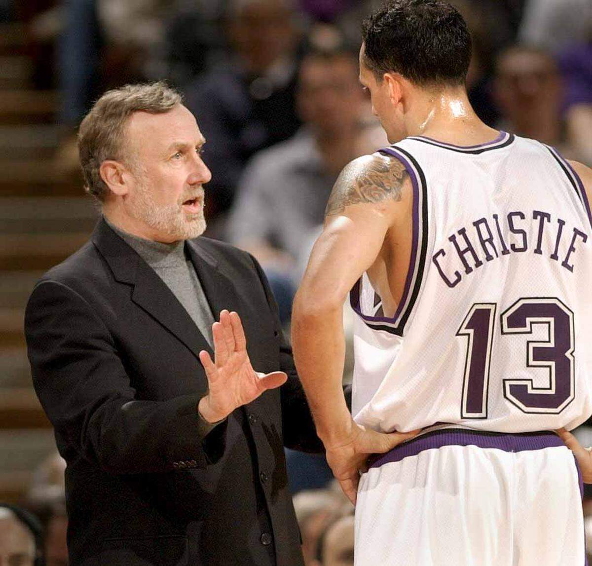Sacramento Kings coach Rick Adelman discusses strategy with Doug Christie against Cleveland on Jan. 15, 2002 at Arco Arena.