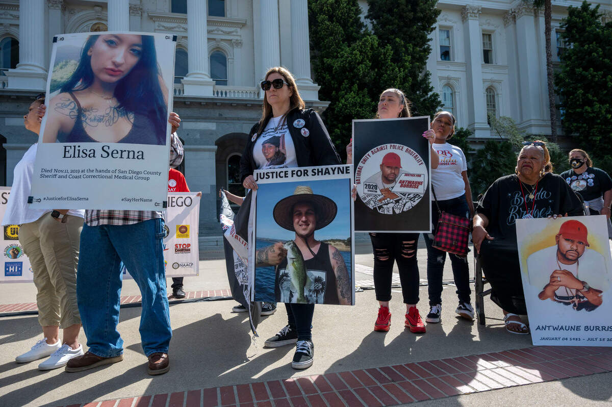 People gather in memory of loved ones who were killed by law enforcement during the I Am SAC Foundation march on Friday at the Capitol in Sacramento on the fourth anniversary of the killing of Stephon Clark by Sacramento police.