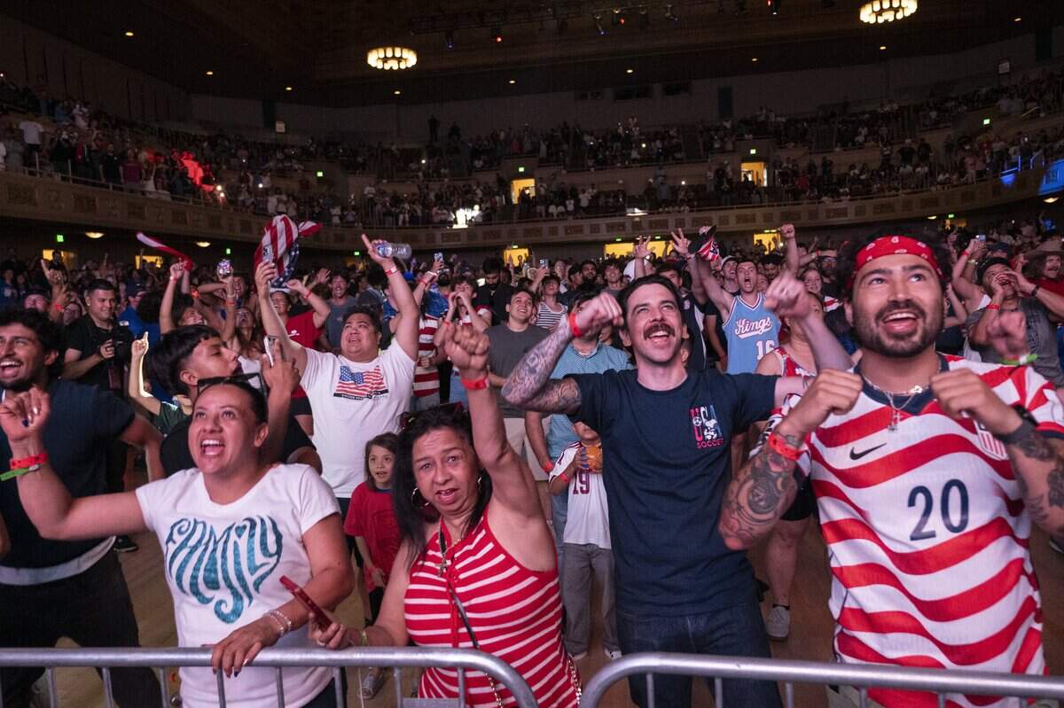 United States fans cheer during a watch party at Memorial Auditorium in Sacramento on Wednesday as the U.S. men's soccer team faced off against Bosnia and Herzegovina in the World Cup. The game, which the U.S. won 2-0, was played in Santa Clara.