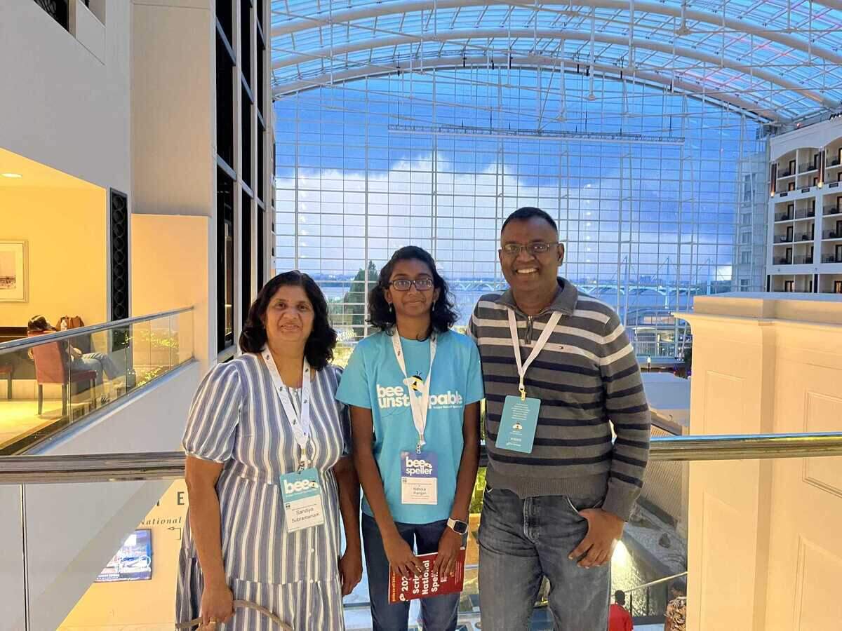Nithika Rangan, center, is photographed alongside her mother Sandiya Subramaniam and father Naveen Rangan at the Scripps National Spelling Bee held in National Harbor, Md.