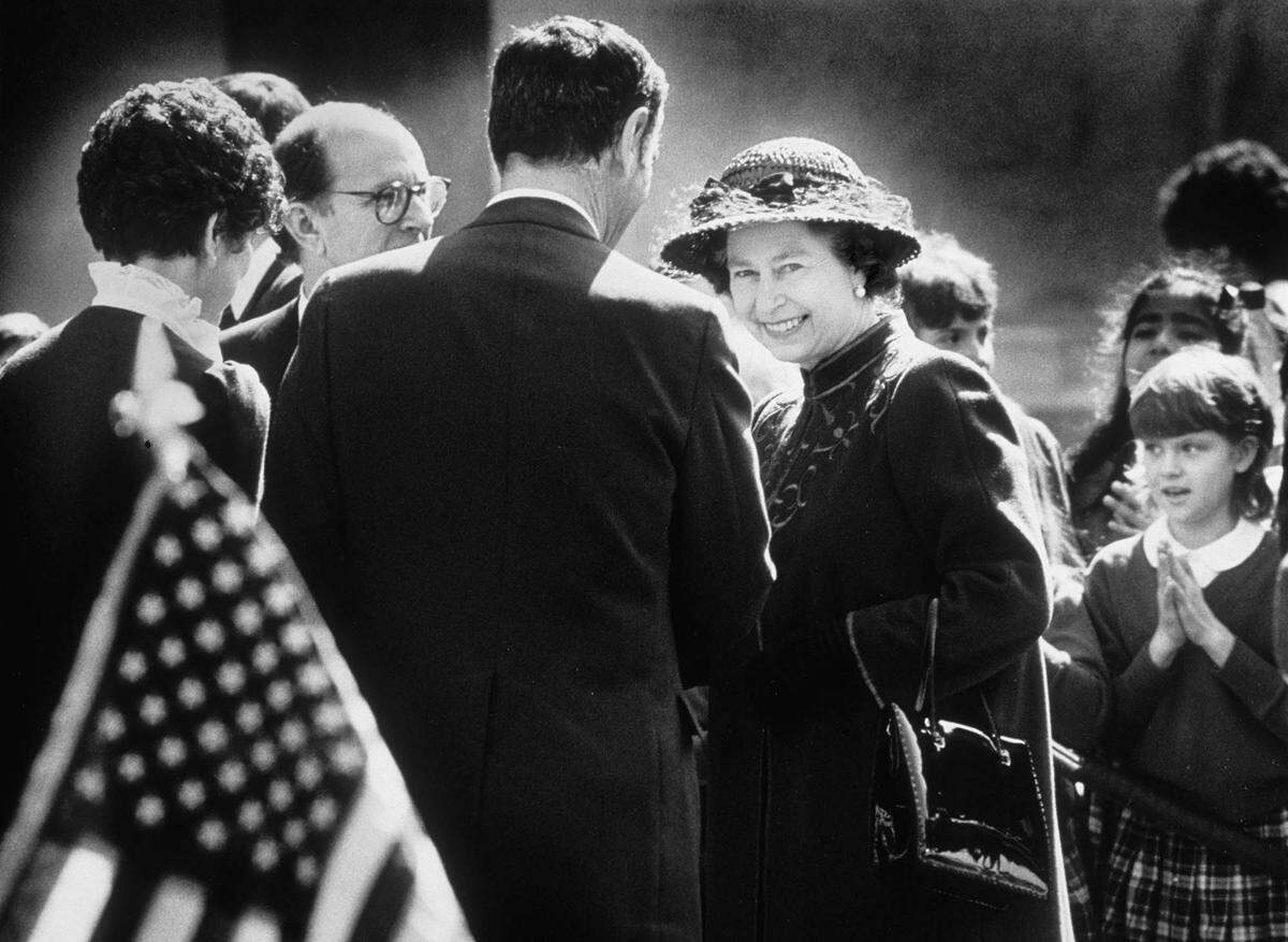 Queen Elizabeth is greeted by California Gov. George Deukmejian outside the state Capitol during her visit to Sacramento in March 1983.