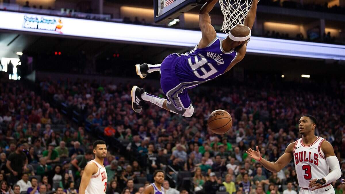 Sacramento’s Corey Brewer hangs on basket after dunking against the Chicago Bulls during a game at Golden 1 Center on Sunday, March 17, 2019 in Sacramento.