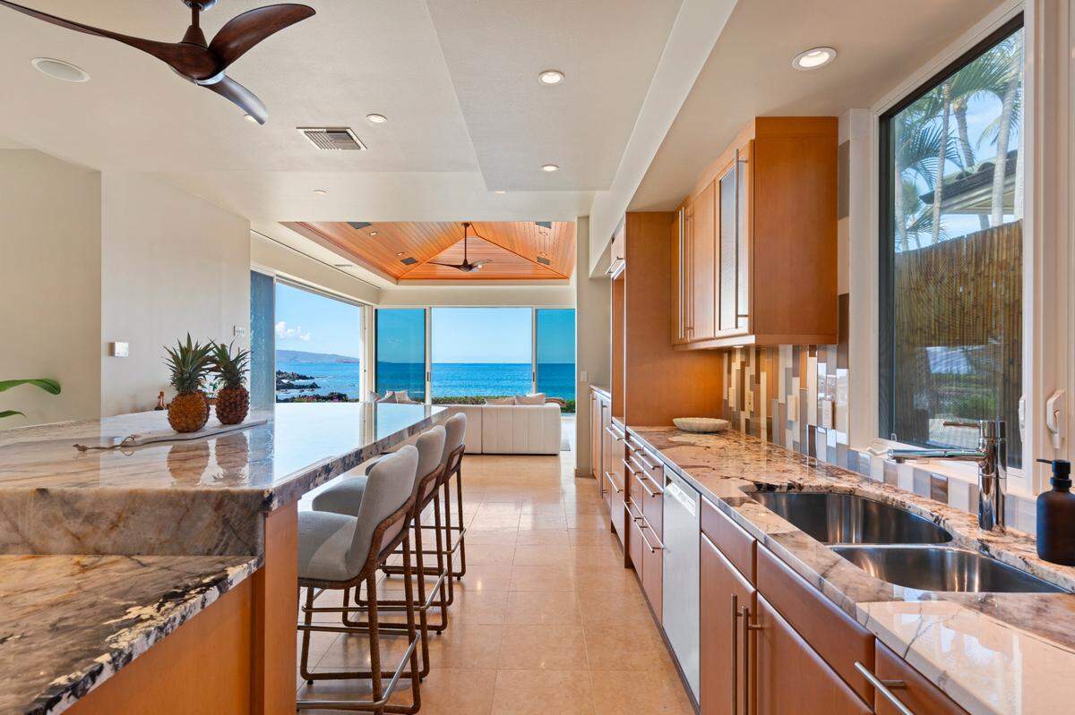 The recently updated kitchen with bar seating for six.