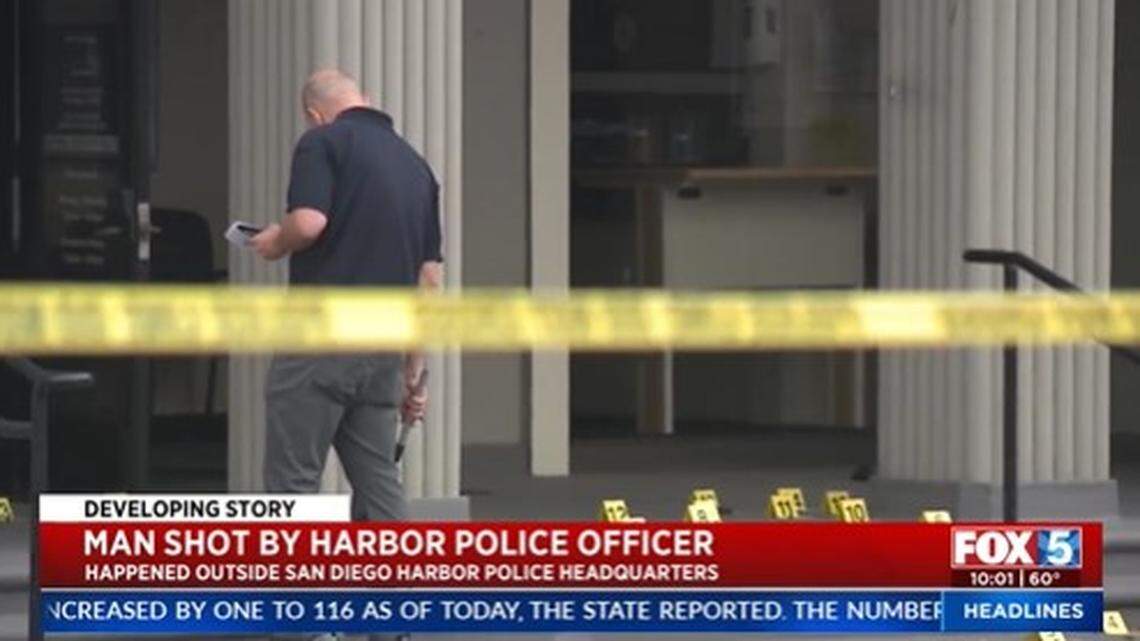 Officers shot a 29-year-old man who called them outside a San Diego Harbor Police station, then brandished a gun in the parking lot, California officials said.