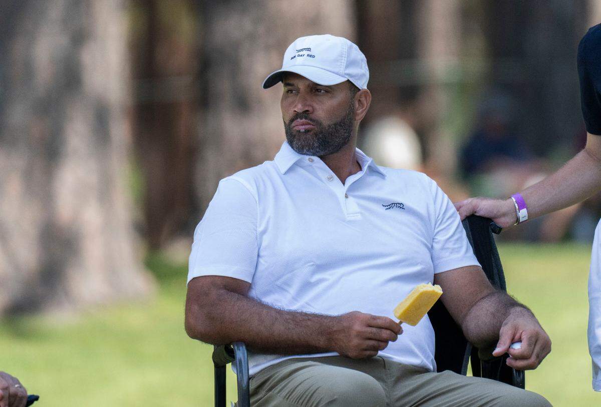 Former MLB player Albert Pujols eats a fruit bar as he takes a break druing the final day of the American Century Championship celebrity golf tournament at Edgewood Tahoe Resort in Stateline, Nev., on Sunday, July 13, 2025.