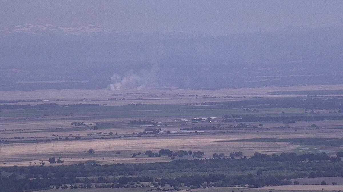 The view of a small grass fire burning in the Wilton area of Sacramento County, as seen from a PG&E wildfire camera positioned in Walnut Grove on Tuesday, June 20, 2023.