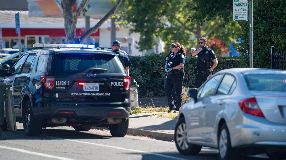 Police canvass the Curtis Park neighborhood for witnesses after a man was wounded in a shooting reported Monday afternoon on Monday near 24th and X streets in Sacramento.