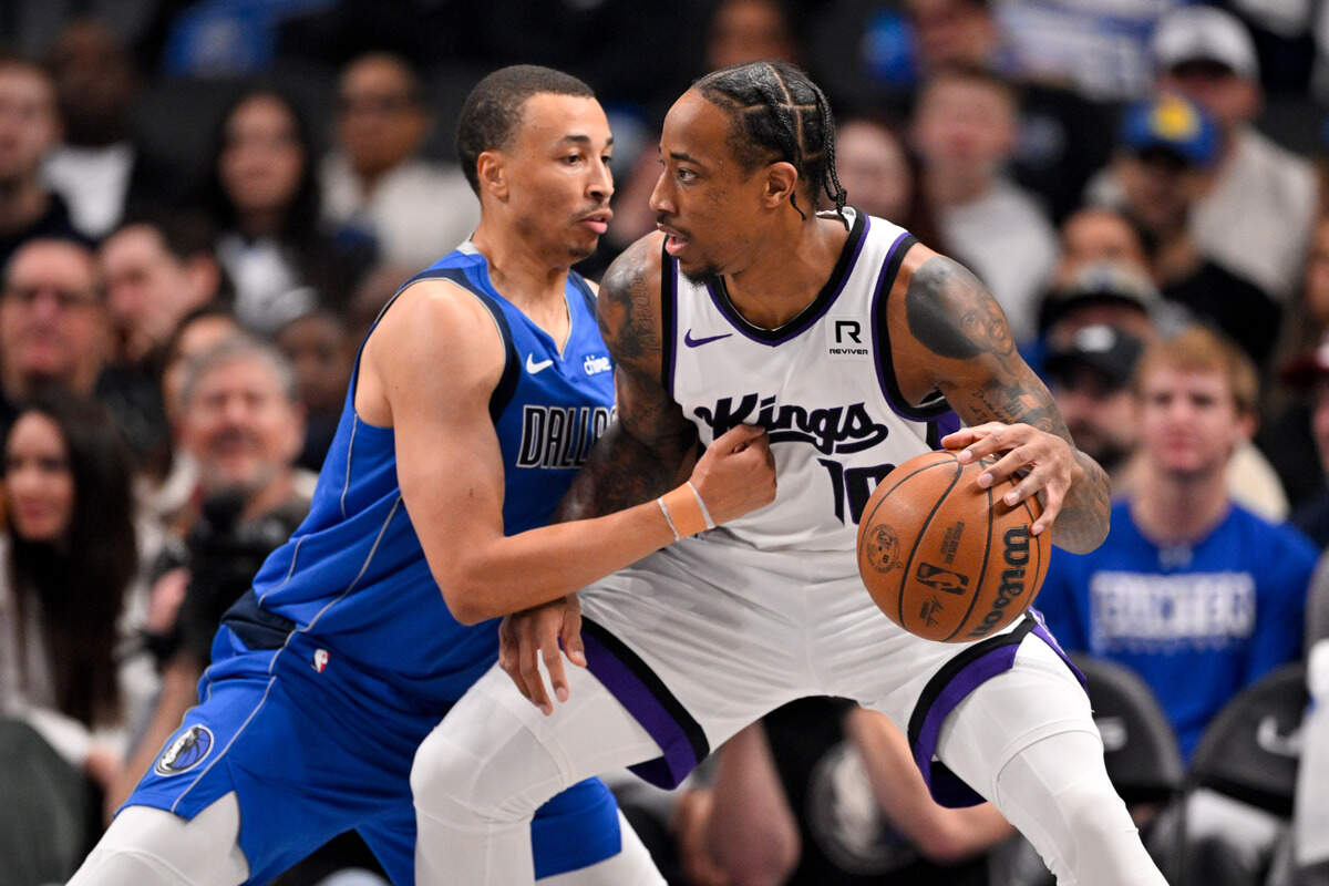 Sacramento Kings forward DeMar DeRozan (10) looks to move to the basket past Dallas Mavericks guard Dante Exum (0) during the first quarter Monday, Feb. 10, 2025, at the American Airlines Center in Dallas, Texas.