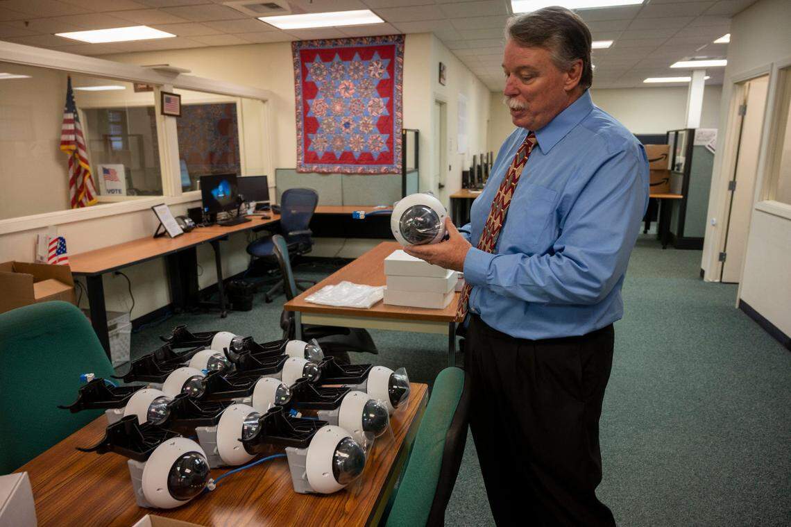 Bill O’Neill, registrar of voters for El Dorado County, talks about security measures earlier this month as he shows cameras that will be installed at each of the voting centers ahead of the November election. O’Neill said the cameras will monitor voting equipment at night and will be covered and inactive while people are voting.