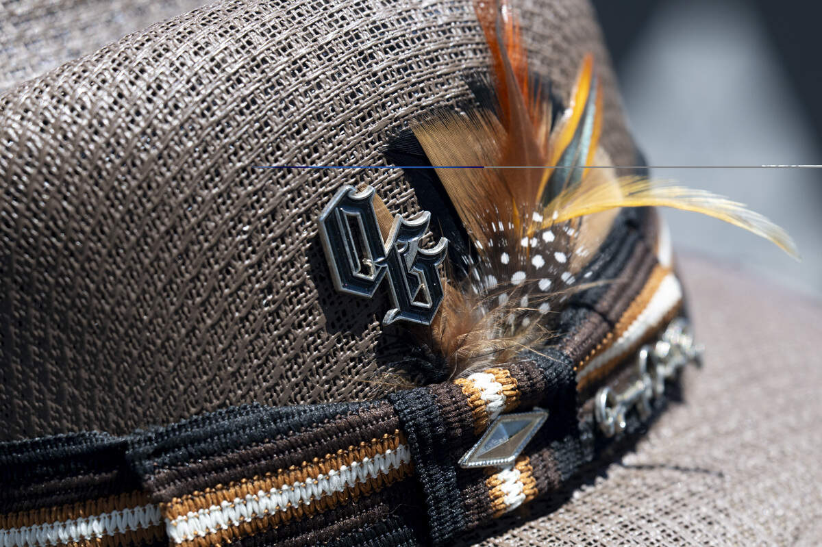 Feathers adorn Antonio Cardenas’s hat at the fourth annual Lowrider Holiday Celebration in Sacramento on Sunday, June 21, 2026. Cardenas founded The Originals car club and has been lowriding since 1976. He is known as “OG” to many.