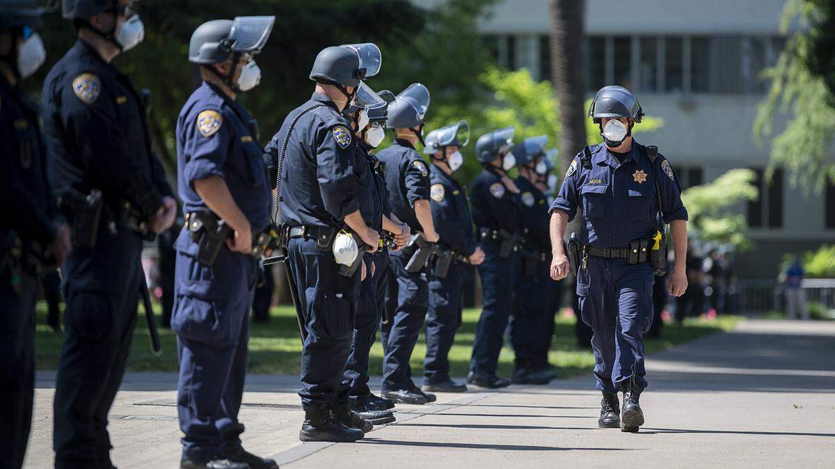 California Highway Patrol officers guard the state Capitol grounds during a protest against Gov. Gavin Newsom’s coronavirus stay-at-home order in 2020.