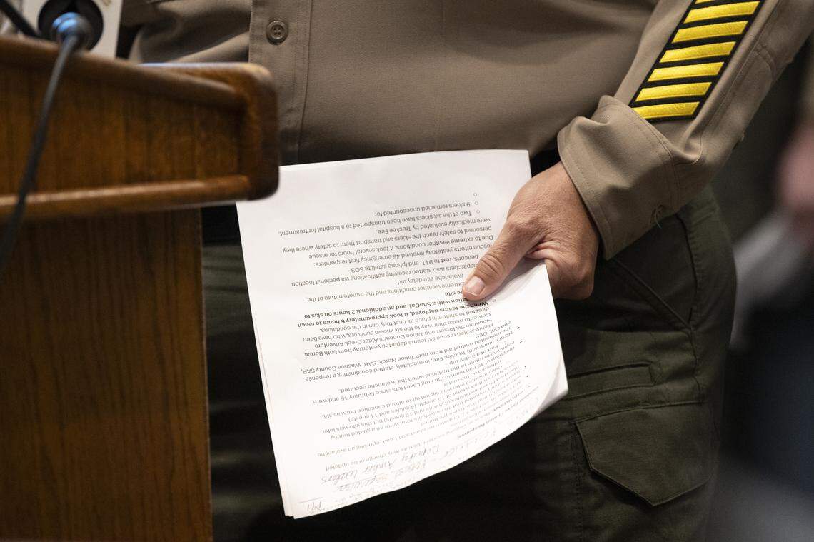 Nevada County Sheriff Shannan Moon holds her notes as she gives a press conference at the Eric Rood Government Center in Nevada City on Wednesday, Feb. 18, 2026, regarding an avalanche that took place the day prior in the backcountry.